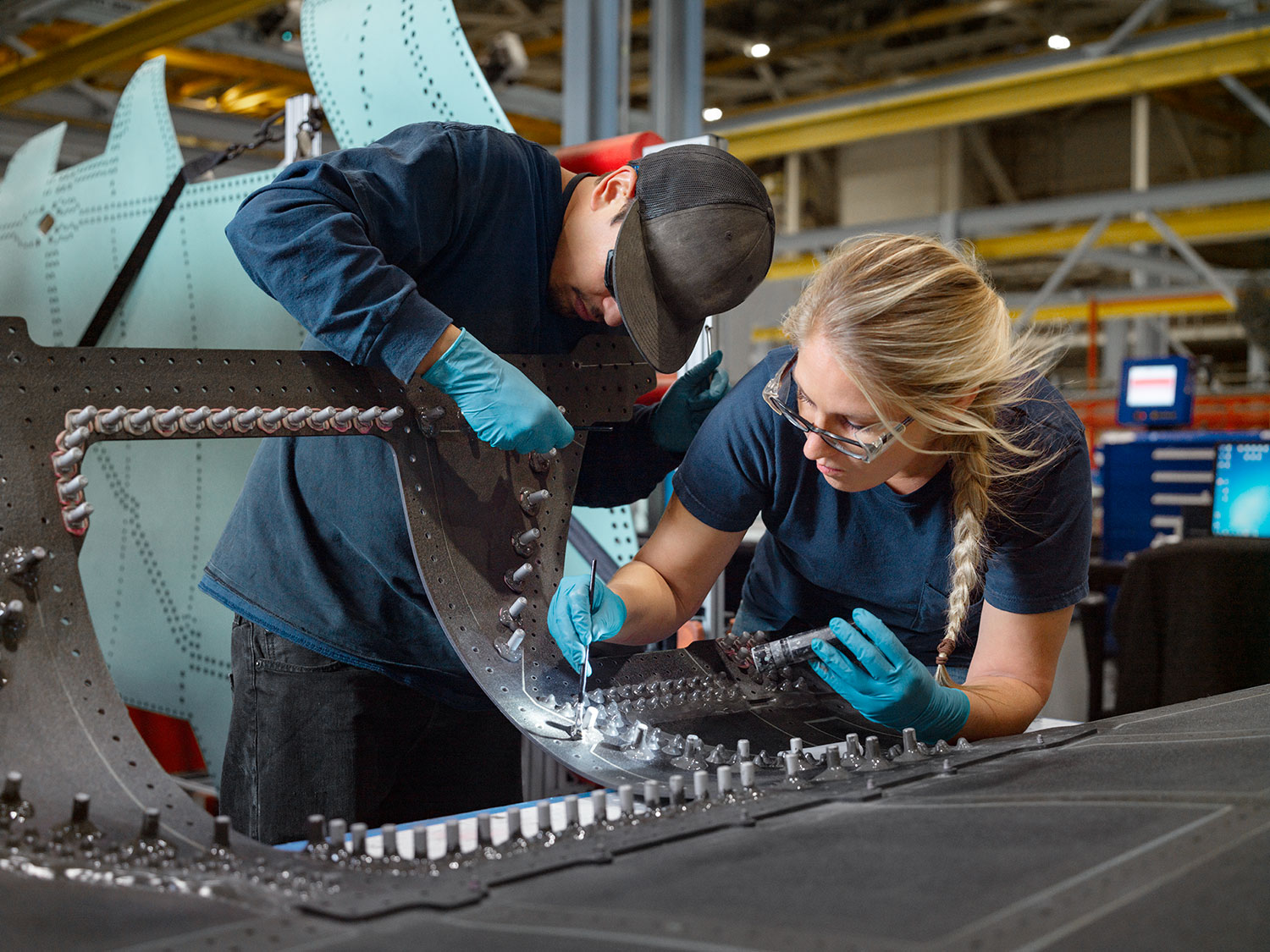 male and female working on aircraft