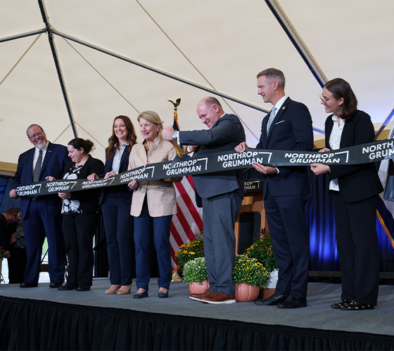 group of team members cutting Northrop Grumman ribbon