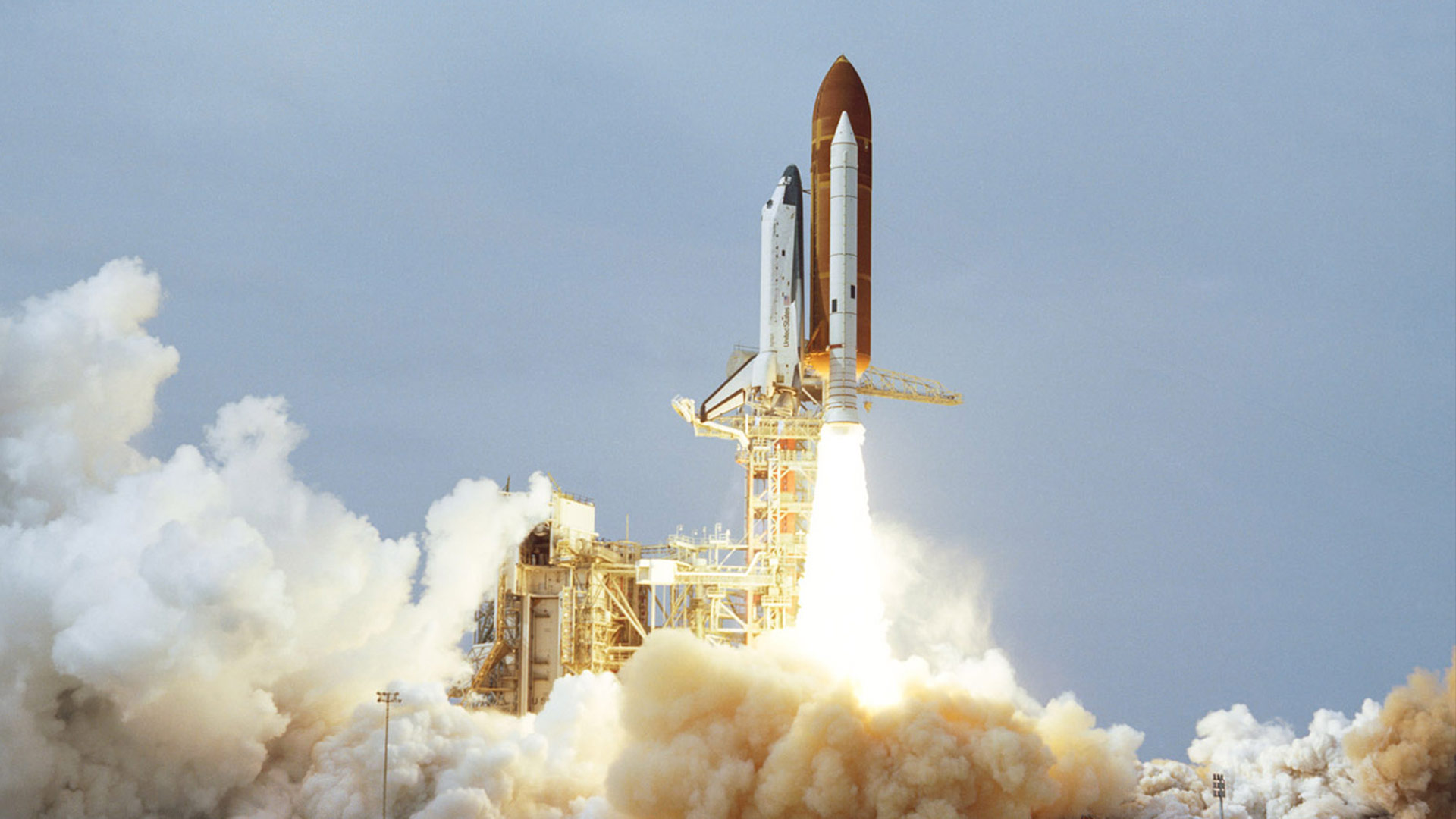 Space Shuttle launch on clear day