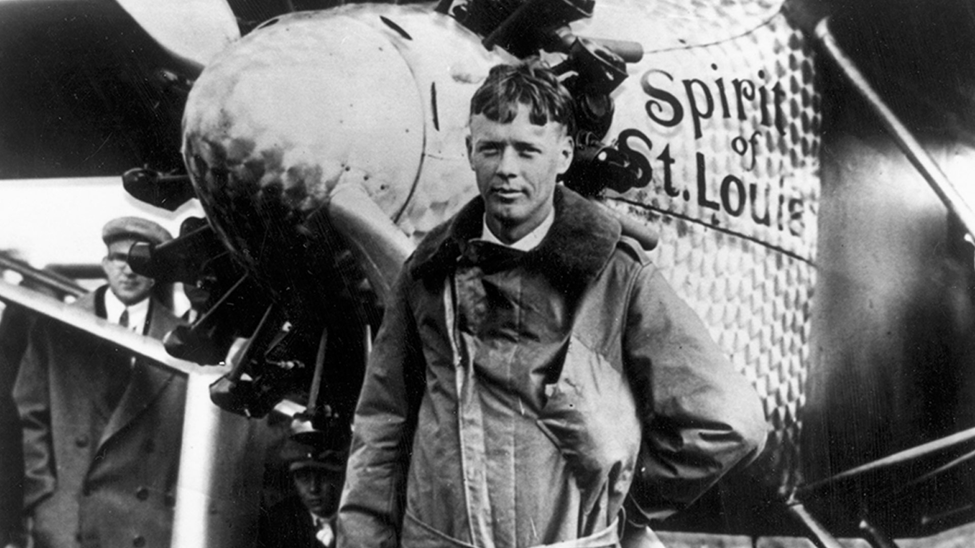 Pilot Charles Lindbergh in front of Spirit of St. Louis aircraft