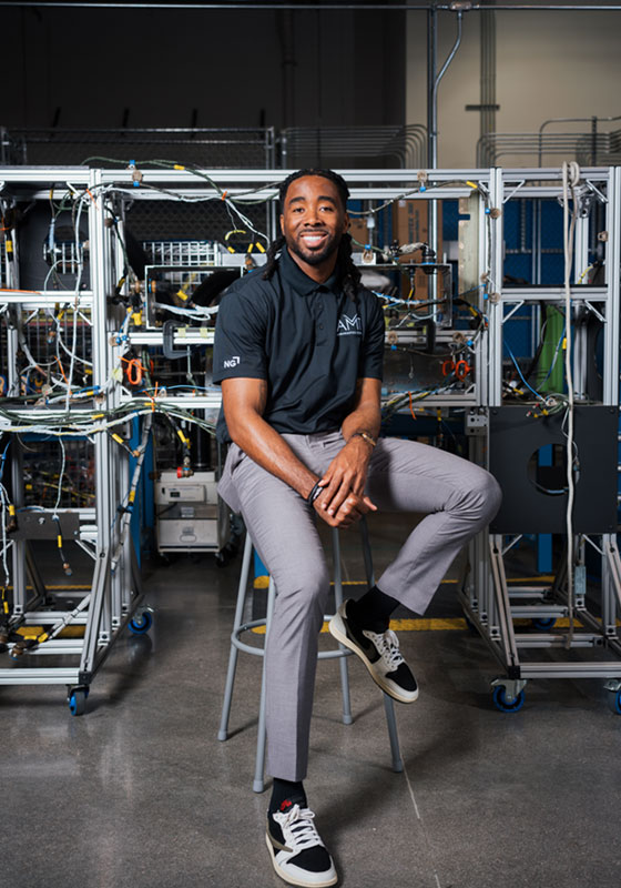 engineer seated on stool in facility
