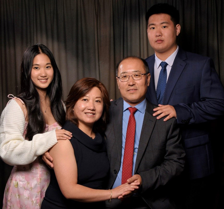 Group photo featuring individuals in professional attire, highlighting collaboration and teamwork in a formal setting.