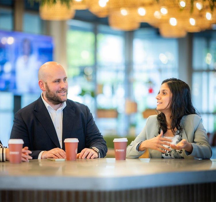 Northop Grumman employees having a conversation 