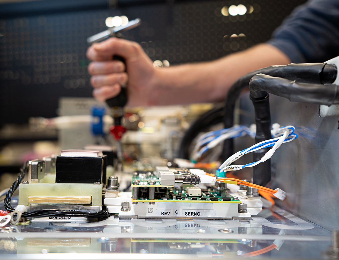Employee working on circuit board in Sykesville, MD