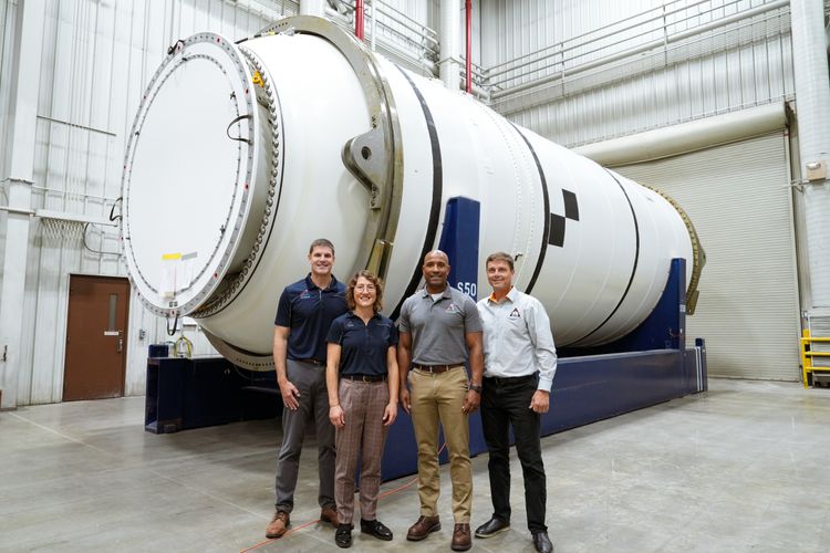 Northrop Grumman’s twin solid rocket booster segments with Artemis II astronauts (from left to right: Jeremy Hansen, Christina Koch, Victor Glover and Reid Wiseman). (Photo Credit: Northrop Grumman) Northrop Grumman Delivers Rocket Booster Segments for NASA’s Artemis II Mission