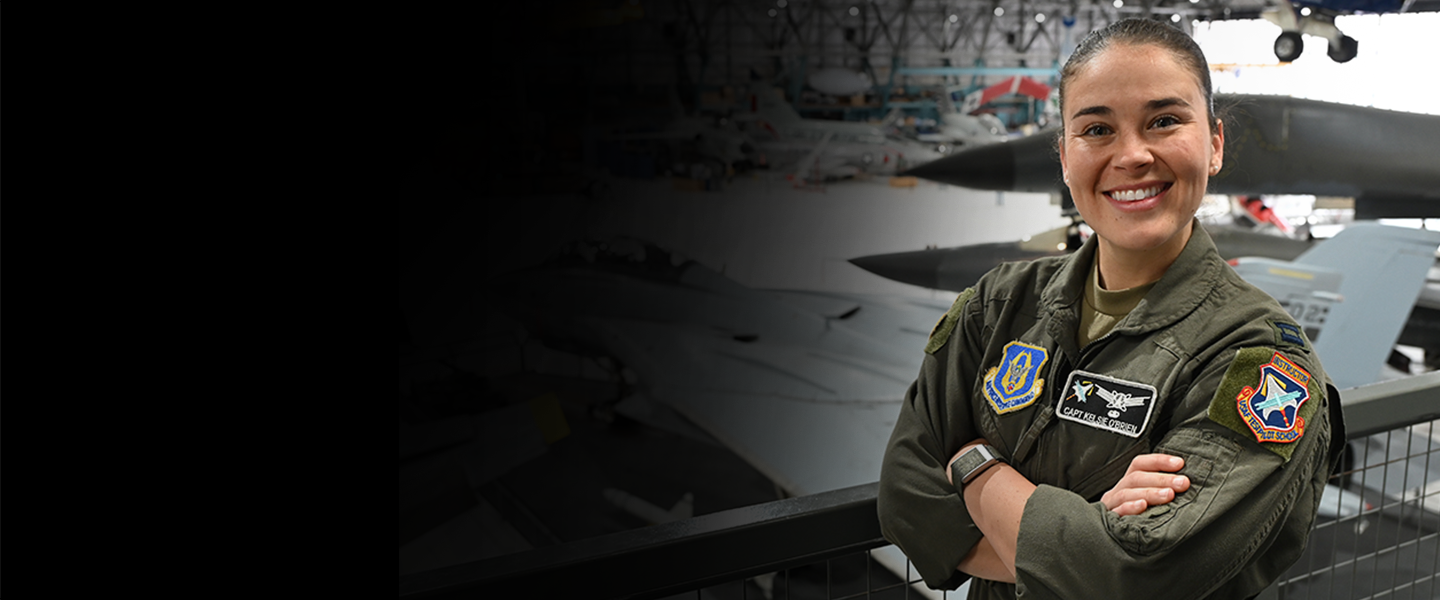 women crossing her arms smiling