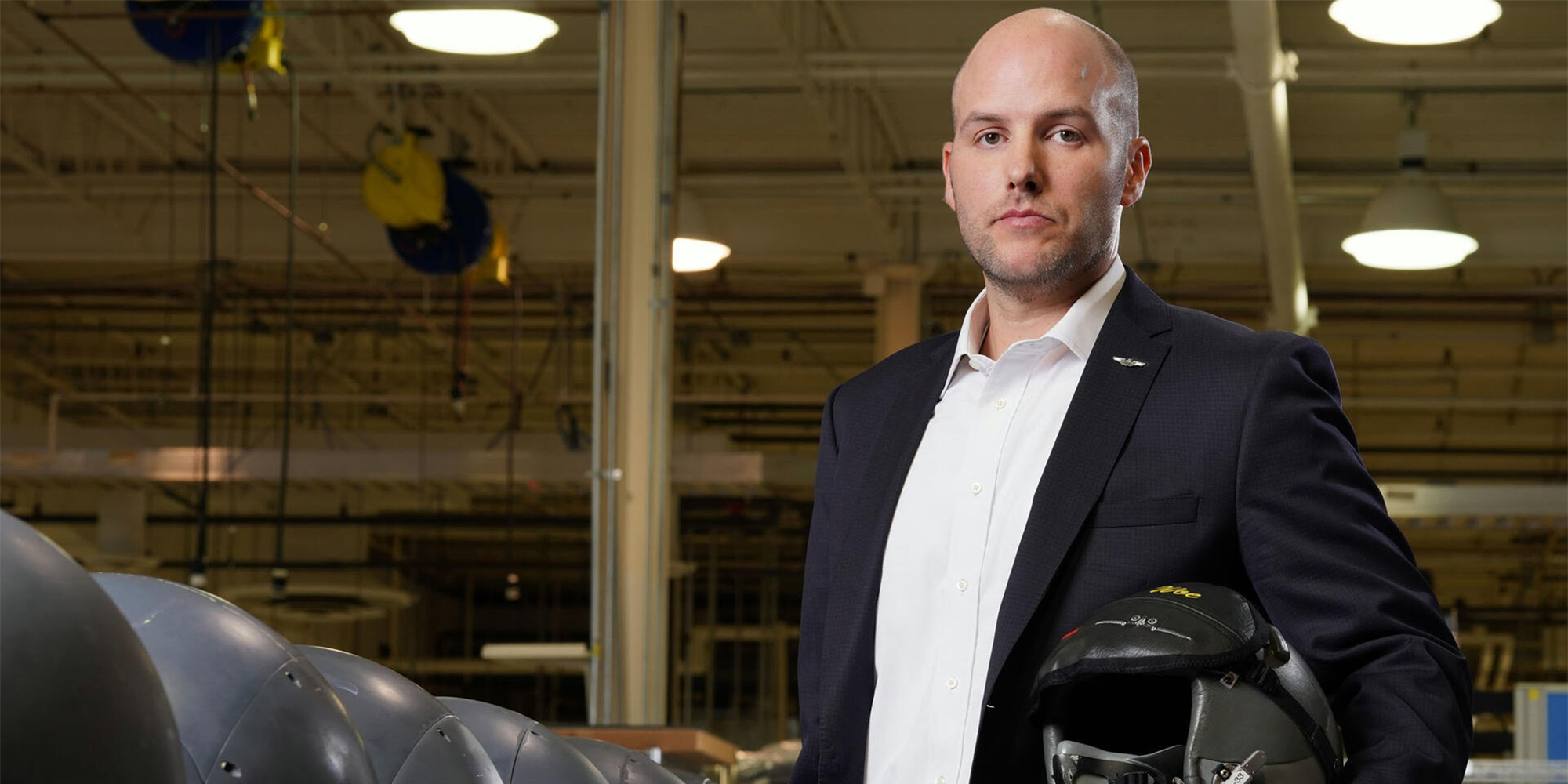 man holding a military helmet