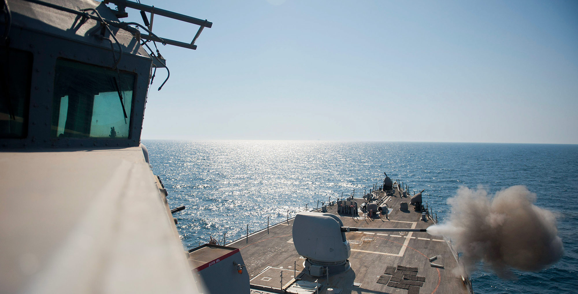 USS ARLEIGH BURKE (DDG 51), AT SEA guided missile destroyer at sea firing gun