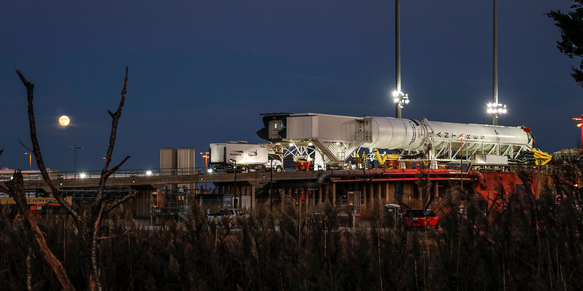 NG-14_AntaresRocket_Cygnus_Wallops_Night Night shot with moon of the Antares Rocket belly up on launchpad in Wallops Island, Virginia