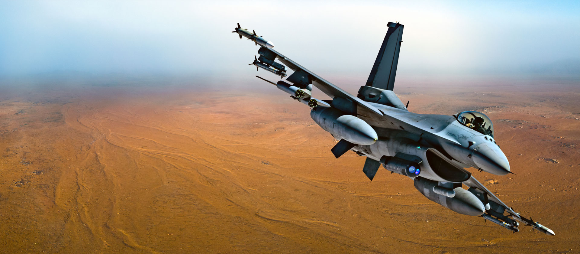 LITENING Advanced Targeting Pod military jet flying over desert