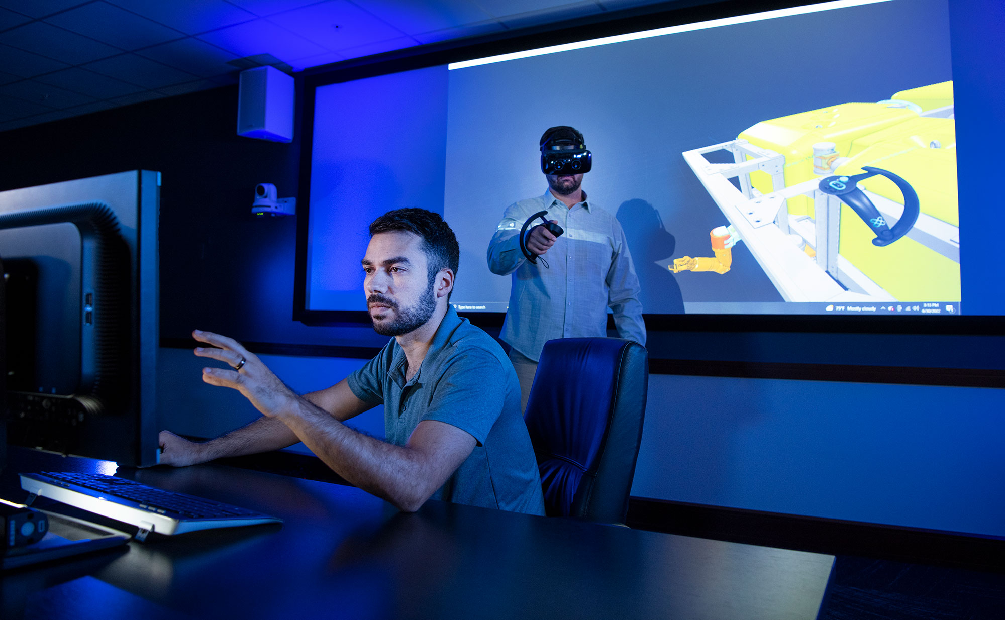 Digitizing Development - Our advanced manufacturing enables simultaneous design, build, prototype, and testing, reducing costs while maintaining high quality two men in virtual reality lab