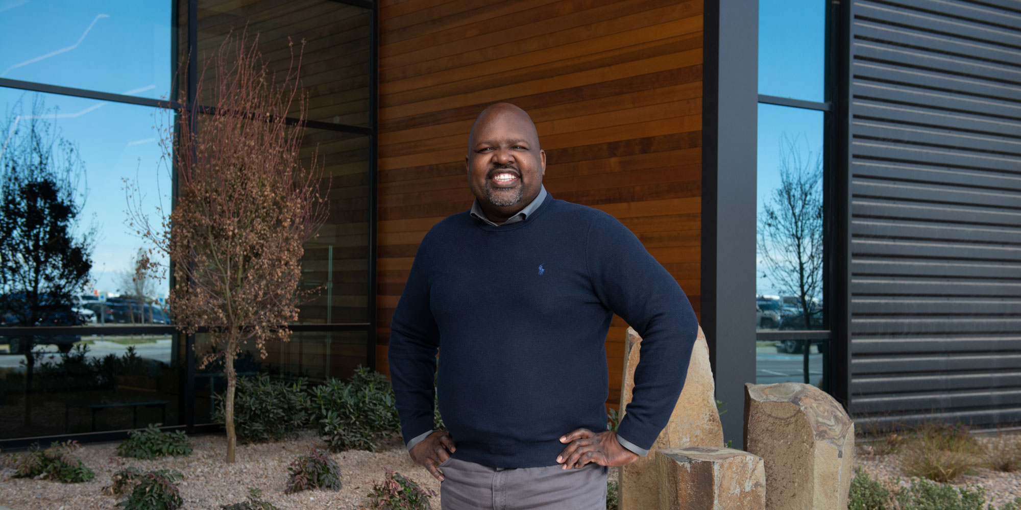 Stephen Guine smiles while looking directly at viewer.