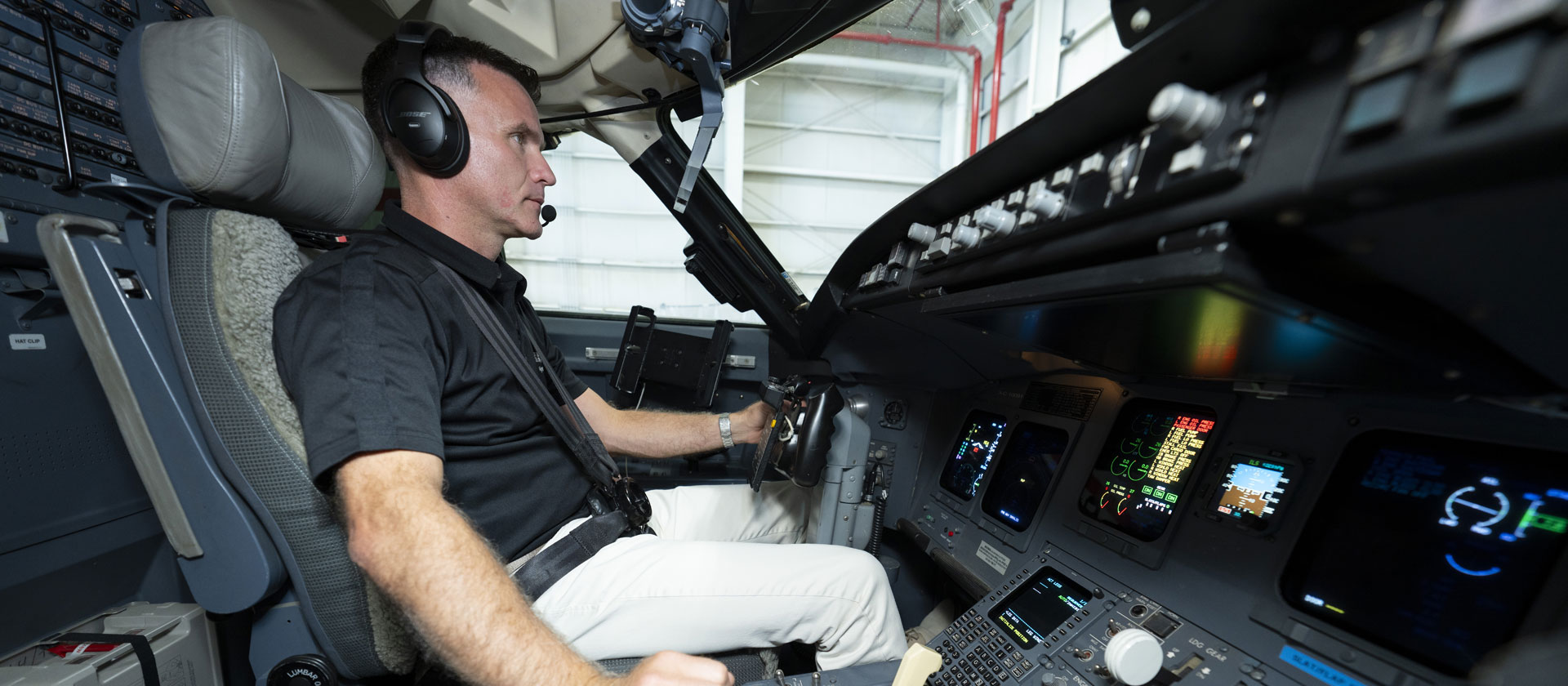 side view of pilot in cockpit