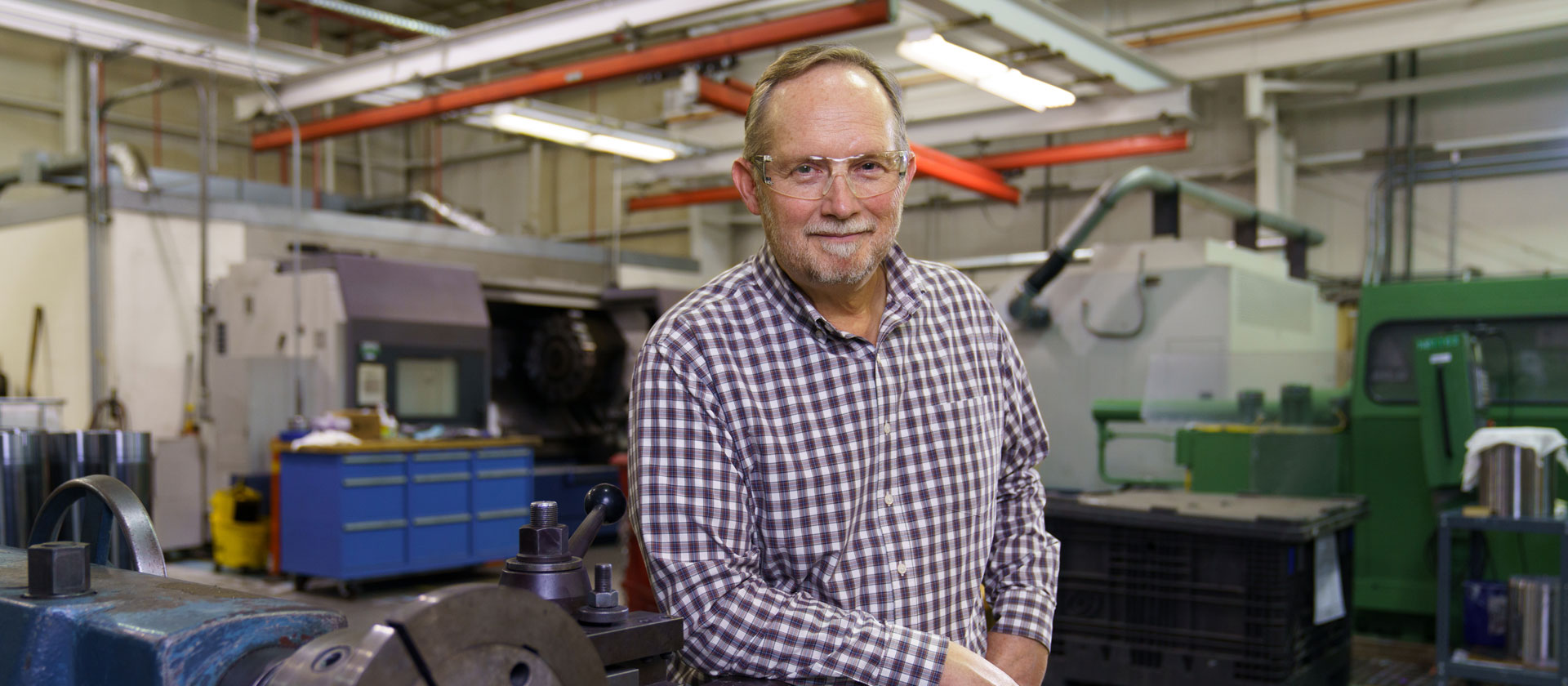Man in front of machinery