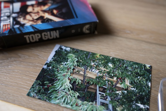 post card and top gun VHS tape