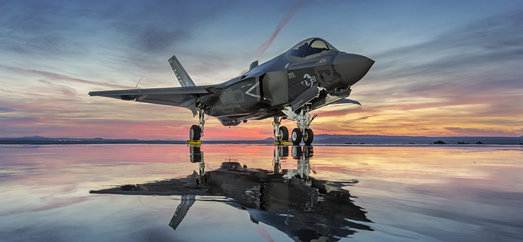 F-35 Lightning II stealthy, supersonic, multirole fighter Standing, side-front view of an F-35 at sunset