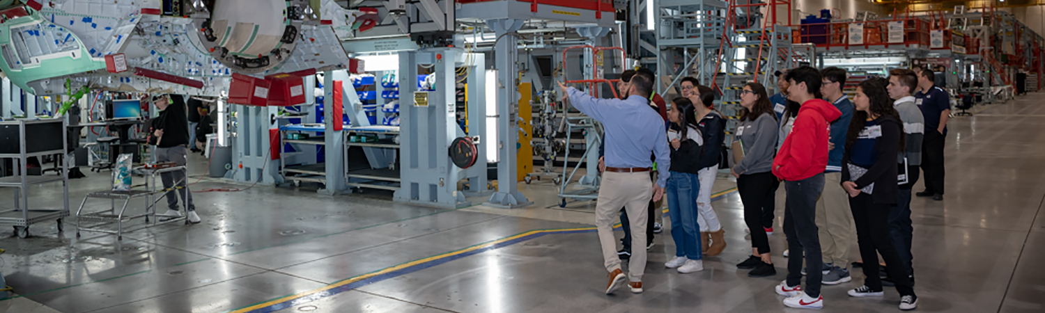 HIP program A High School Involvement Partnership (HIP) mentoring program cohort tours a Northrop Grumman facility