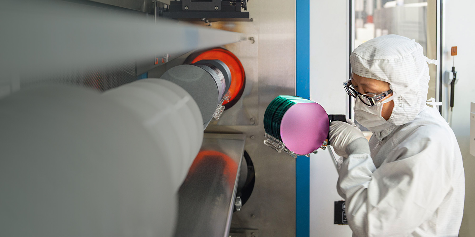 New Circuit Security Method – NGC Home woman in lab suit holding micro disks