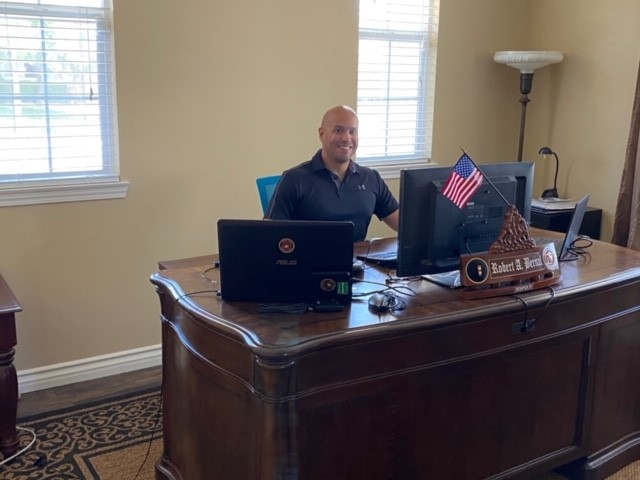 Rob Bernal_sitting at desk <strong><strong>Veteran Spotlight: Meet Marine Corps Veteran Ra</strong></strong>b